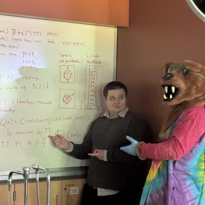 A picture of Jacob Canel teaching the Nittany Lion a theorem