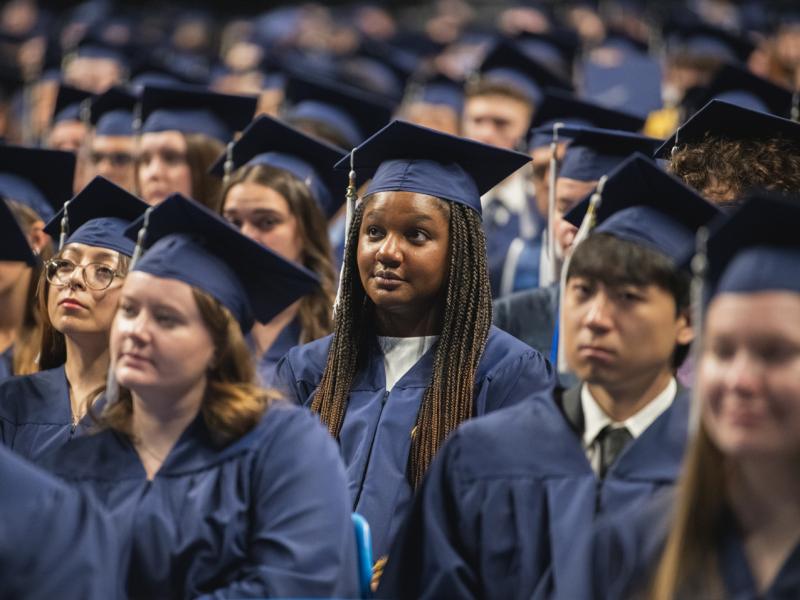 Future college alumni listening to the 2025 Spring Commencement Speaker.
