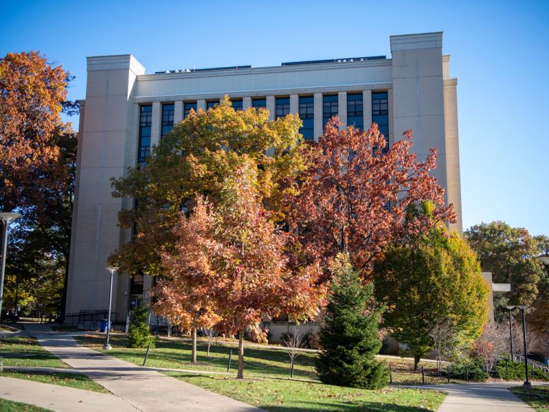 Müller Laboratory during early october with fall foliage in the foreground.