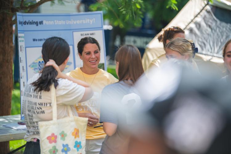 Department of Biology advising members talking to new students during the 2023 welcome day event.