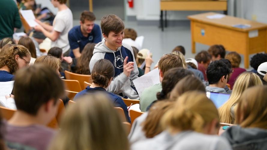LA mark talks to students in large lecture hall