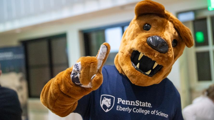 The Nittany Lion wearing an Eberly College of Science shirt