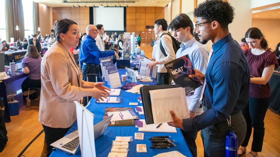 Penn State students talk with a medical school representative during the 2026 Health Professions Expo.