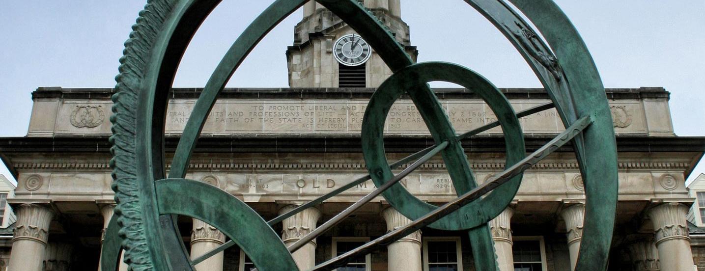 The armillary sphere sculpture at Old Main on the University Park campus.
