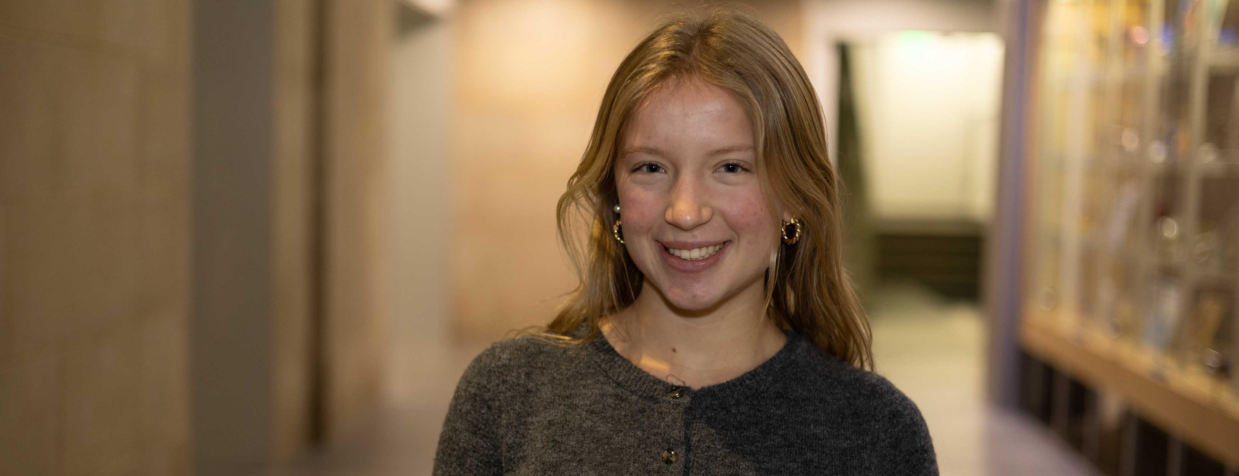 Evelyn Mastaglio stands in a hallway