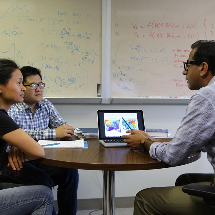 Students talking with a professor