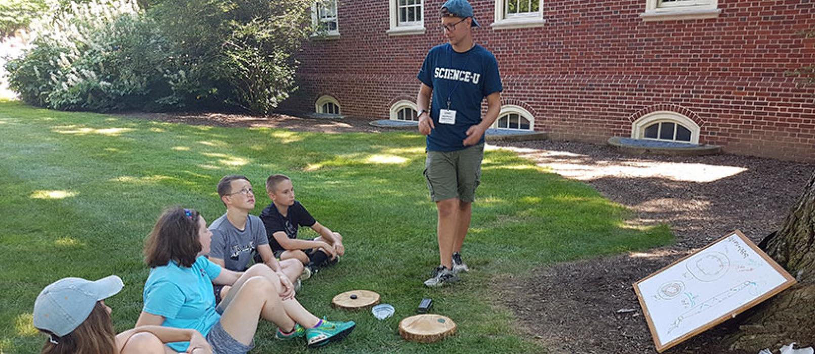 Science-U Mentor showing campers facts about trees
