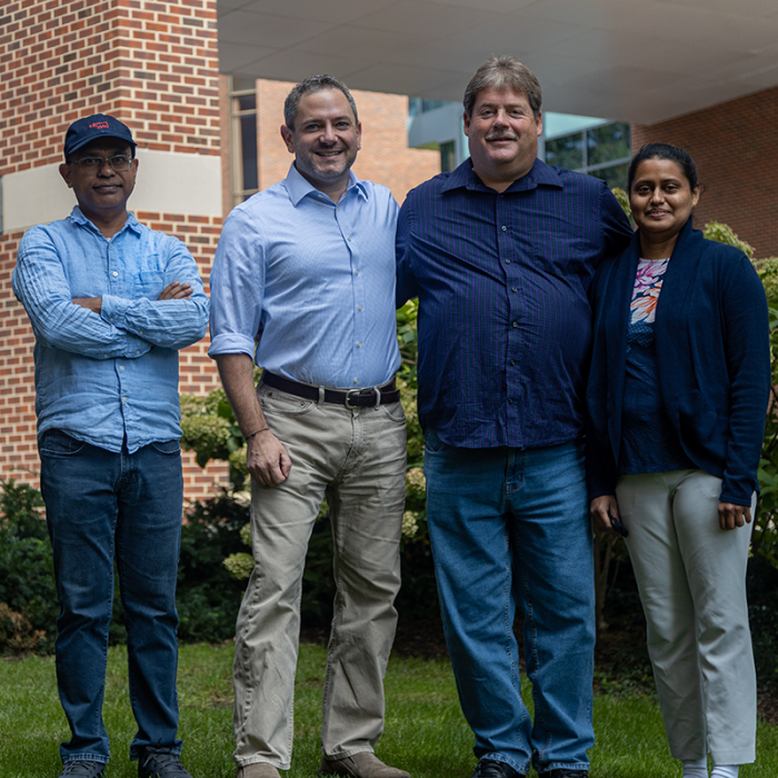 Tapas Mal, Scott Showalter, Larry Johns, and Christy George outside the Chemistry Building