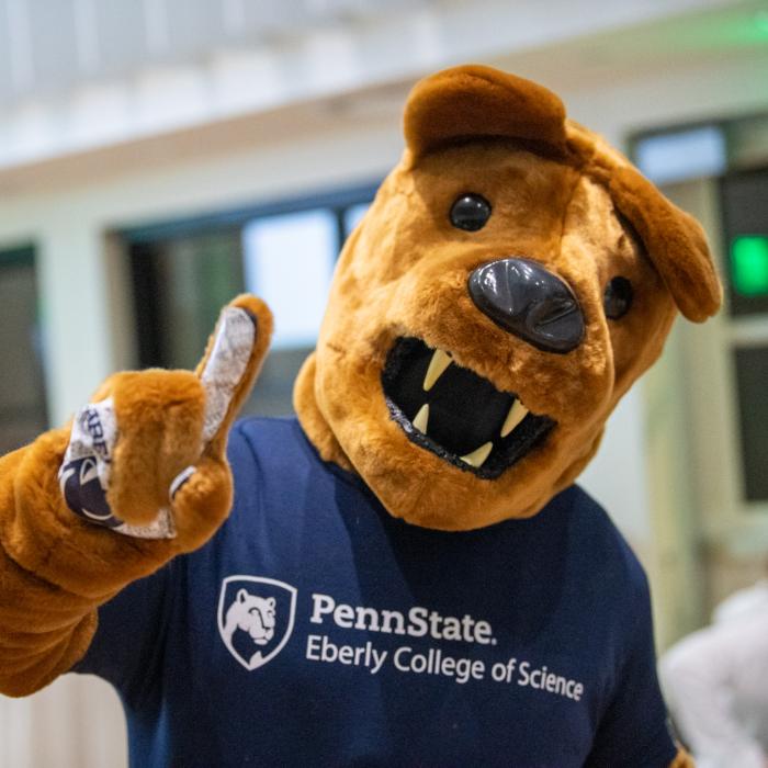 The Nittany Lion wearing an Eberly College of Science shirt