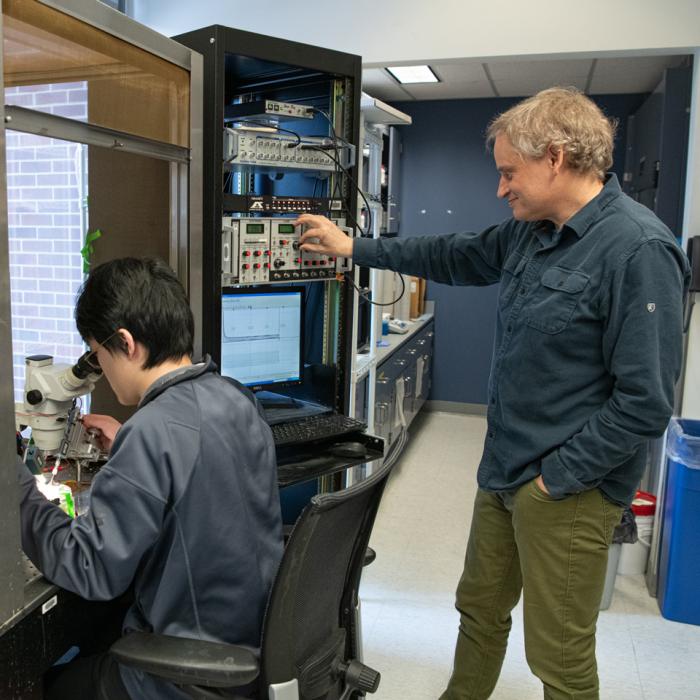Timothy Jegla and a graduate student working in his lab.