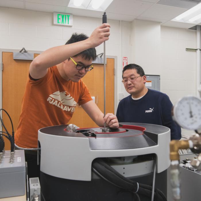 Cui Zu Chang and a graduate student working in his lab at the university park campus.