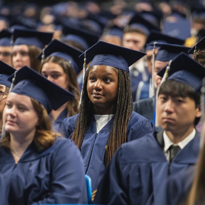 Future college alumni listening to the 2025 Spring Commencement Speaker.