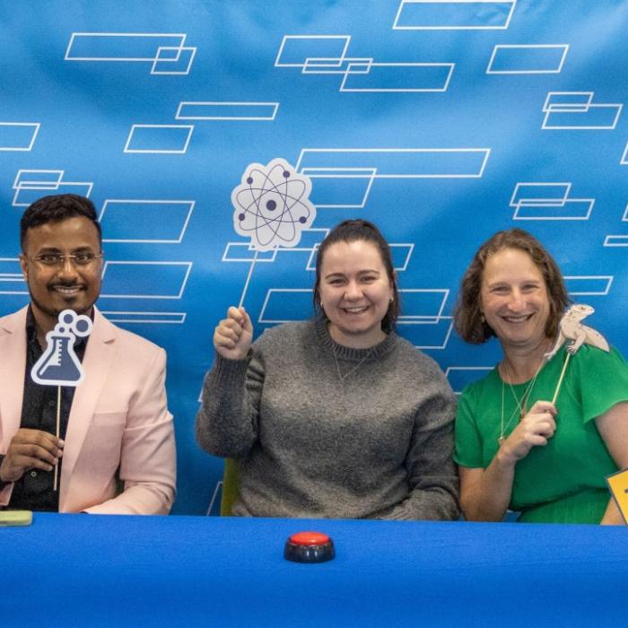 Tracy Langkilde poses for a photo with students at the latest "Trivia With Tracy" event.