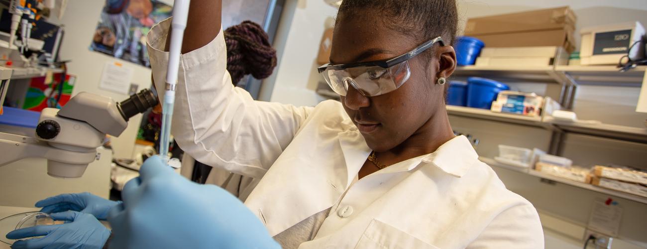 Student in the lab conducting research.