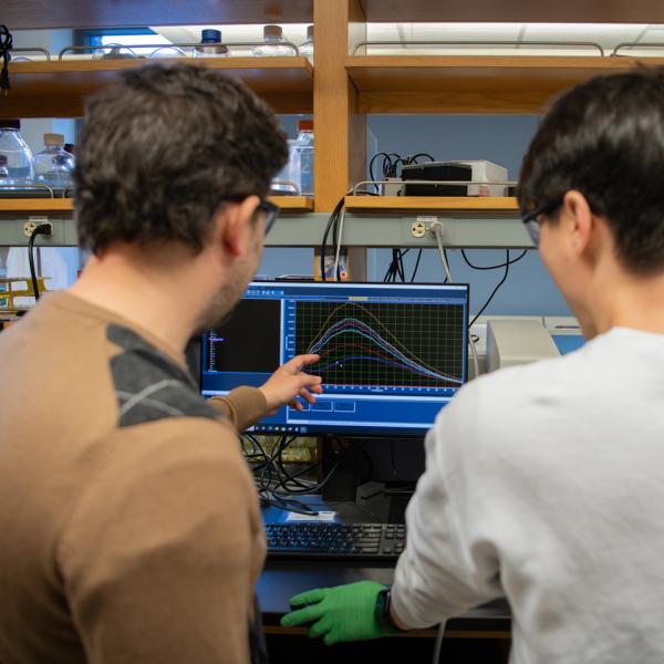 Joey Cotruvo and a graduate student researcher working in his lab.