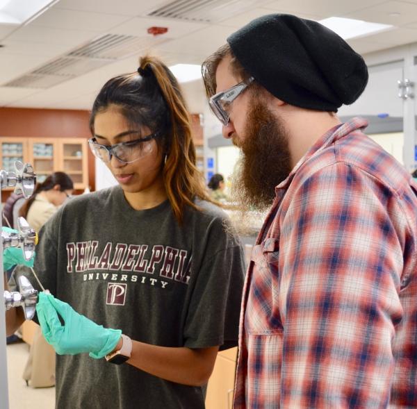 TA Instructs Student