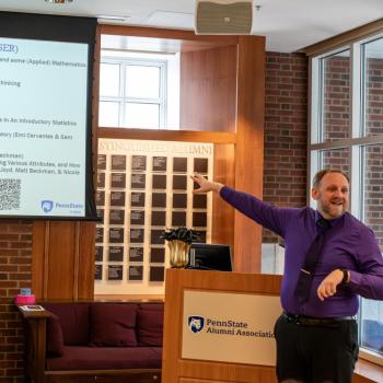 Neil Hatfield presenting to the audience at the 5th Annual Lightning Talks event.