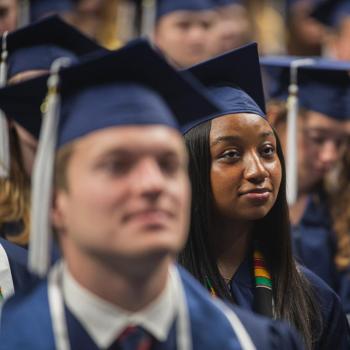 Students listing attentively during the commencement ceremony.