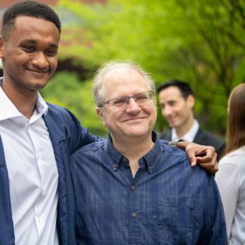 A student and a faculty mentor smiling for a photo.