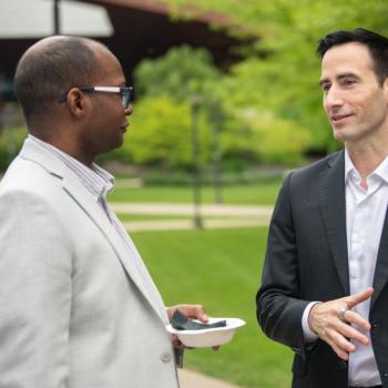 David Simpson talking to our commencement speaker during the reception.