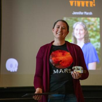 Jennifer Marsh accepting an award at the 2025 Staff Appreciation Ceremony.
