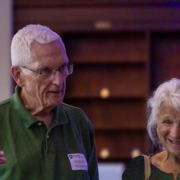 Richard McIntyre speaking with others at the Franklin Institute 