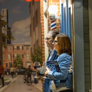 The Kellers looking at one of the displays at the Your Brain exhibit at the Franklin Institute
