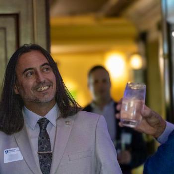 Miguel Mostafa smiling at someone else at the Science Matters: Spotlight Sessions event