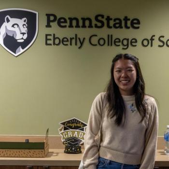 The same coed smiles for a photo at the Eberly College of Science Academic Advising Center.
