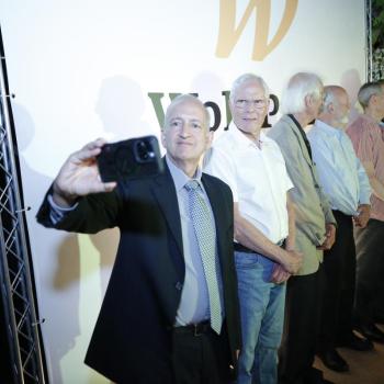 Jainendra Jain taking a selfie at the Wolf Prize ceremony with some other attendees.